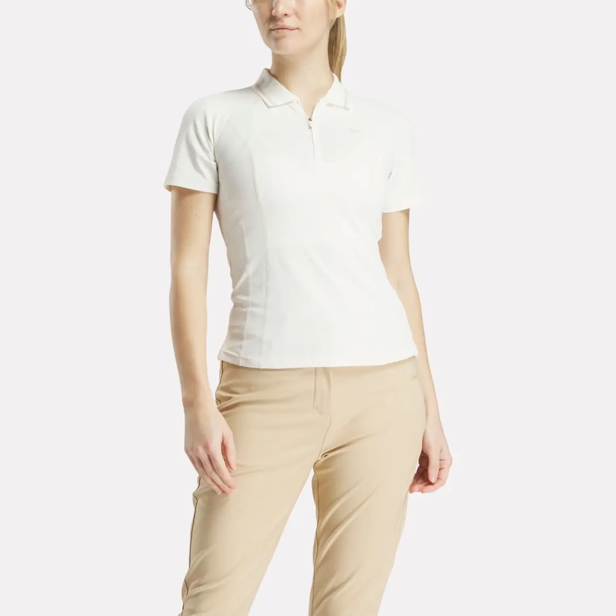 Polo de golf ajusté à manches courtes et fermeture éclair pour femmes