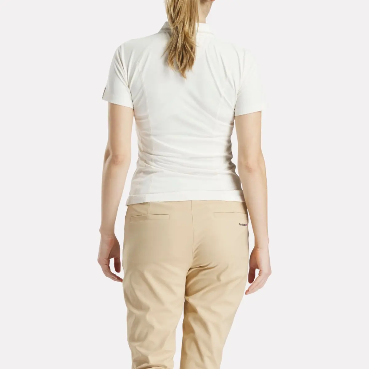 Polo de golf ajusté à manches courtes et fermeture éclair pour femmes Polo de golf ajusté à manches courtes et fermeture éclair pour femmes