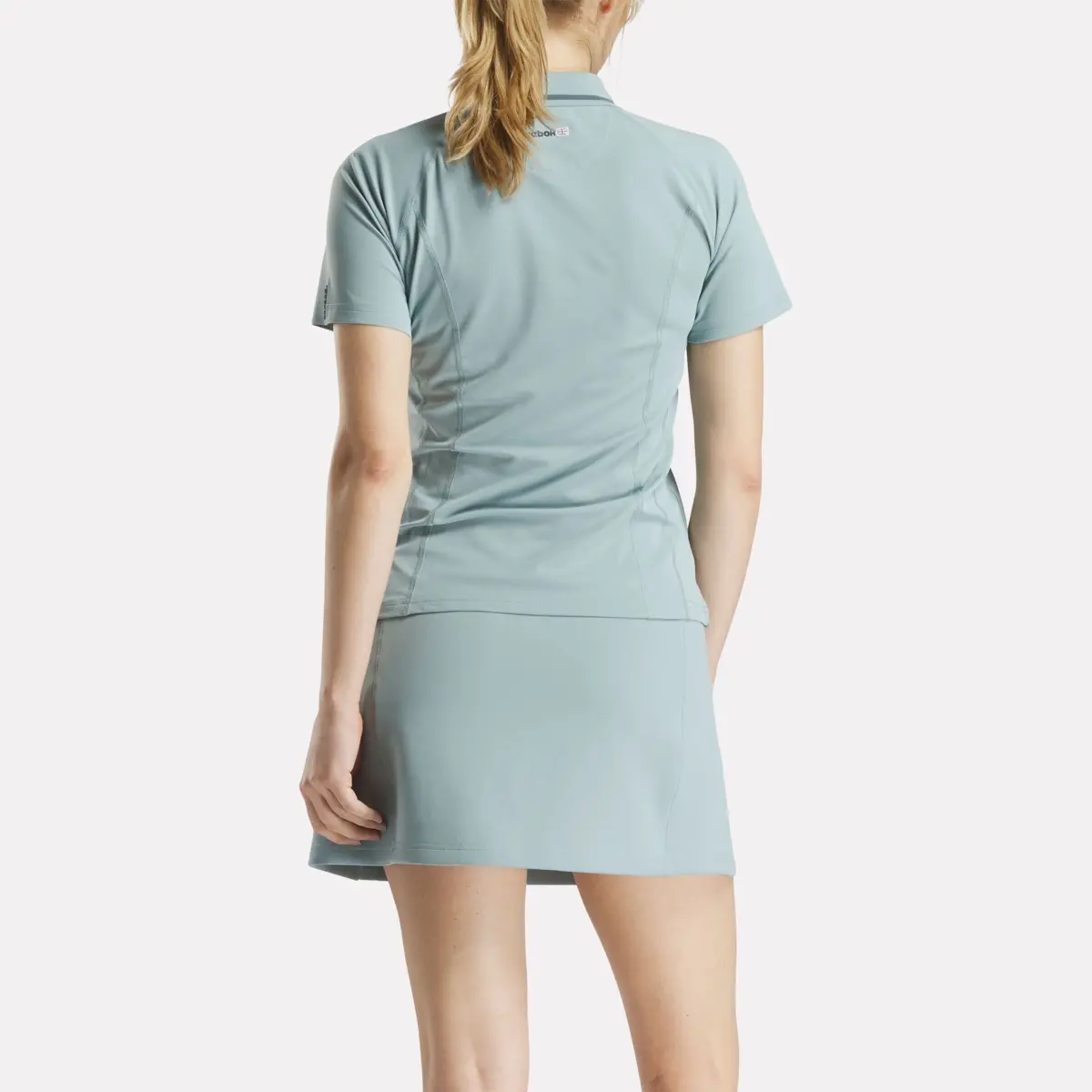 Polo de golf ajusté à manches courtes et fermeture éclair pour femmes Polo de golf ajusté à manches courtes et fermeture éclair pour femmes